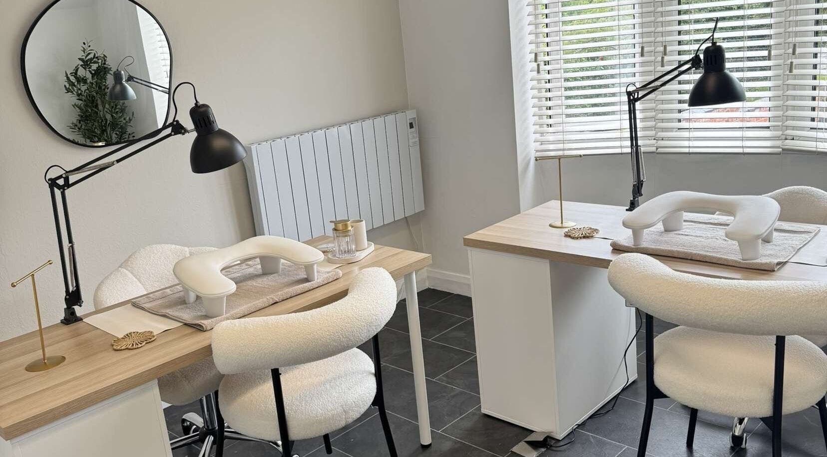 Modern nail stations at Nailsbyxanth, Nantwich, England, GB, featuring sleek design and comfortable chairs.
