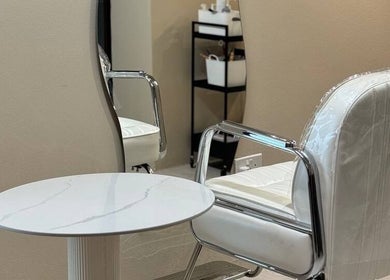 Elegant styling chair and mirror at 888 Studio TBL, Singapore, SG, offering a chic salon experience.