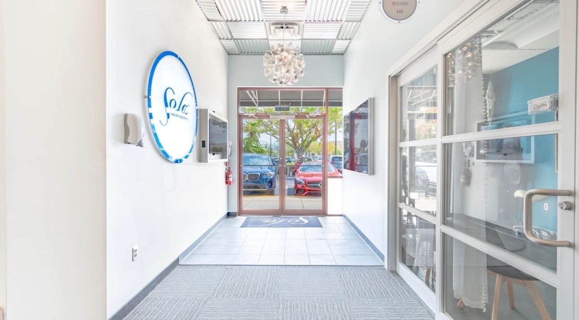 Bright modern entrance of UBS Nails – Ukrainian Beauty Studio in Sarasota, United States, US.
