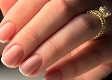 French manicure at UBS Nails – Ukrainian Beauty Studio, Sarasota, United States, US showcases elegant hand.