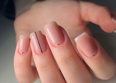 Close-up of elegant glossy nude nails with minimalist dots at UBS Nails – Ukrainian Beauty Studio, Sarasota, United States, US.
