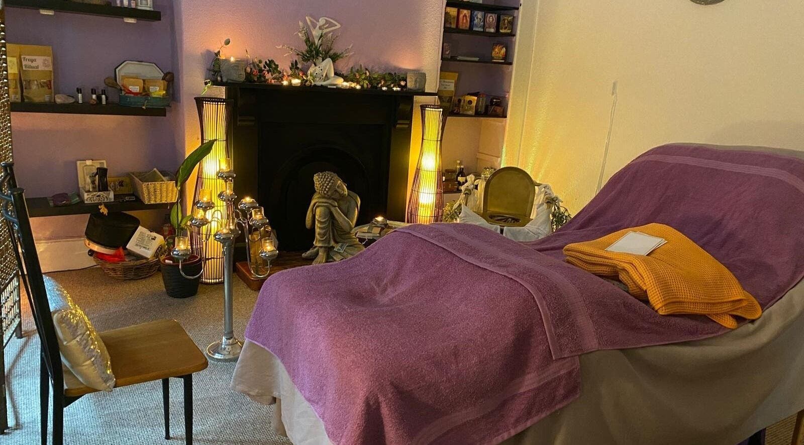 Cozy treatment room at Balance and Bliss, Belfast, Northern Ireland, GB with soft lighting and peaceful decor.