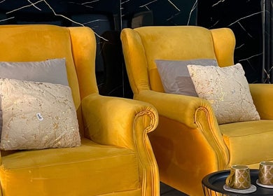 Cozy yellow armchairs at Oasis of Elegance, Lusaka, Lusaka Province, ZM, symbolize luxury relaxation.