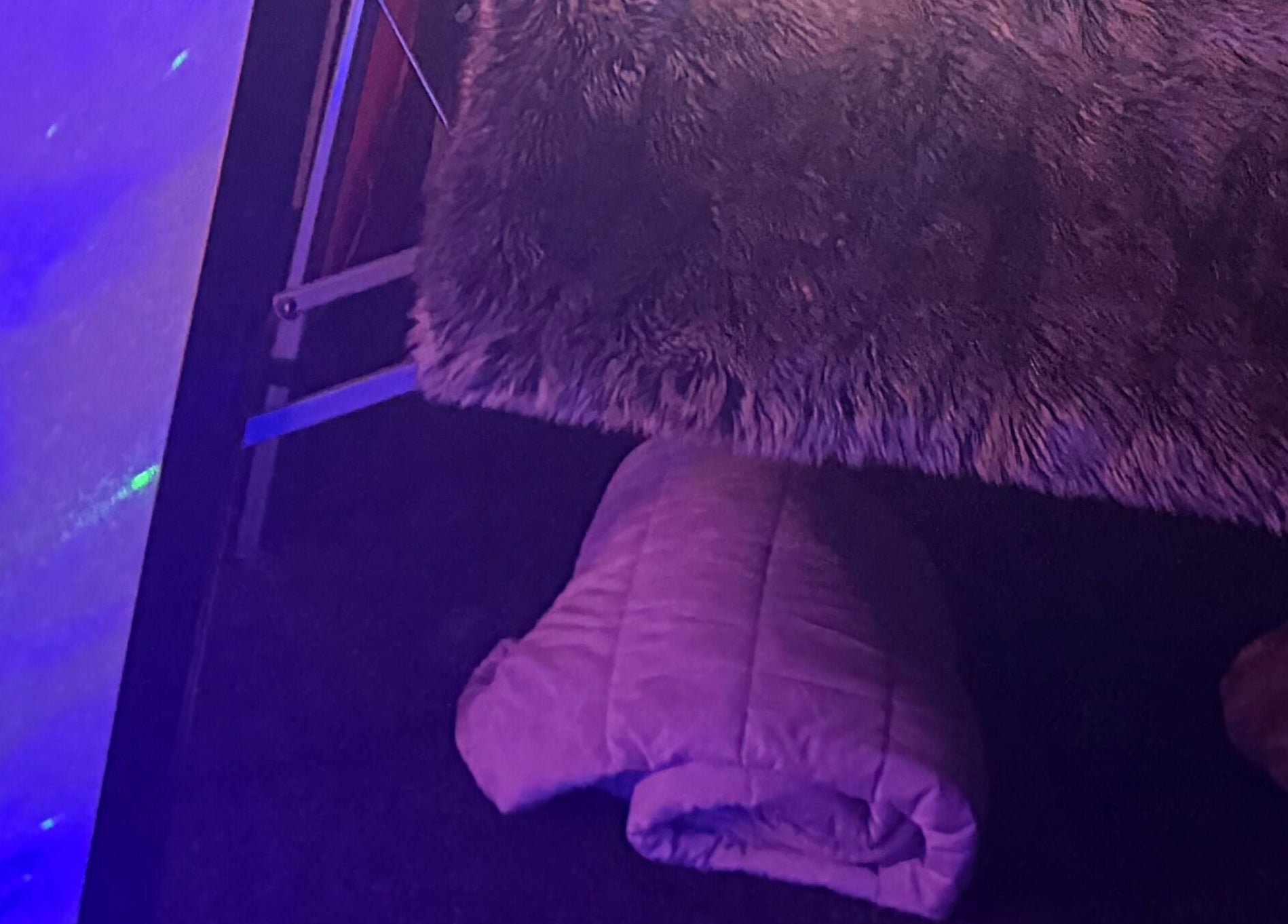 Comfortable massage table at Tays Sensory Massage, Swansea, Wales, GB with ambient lighting.