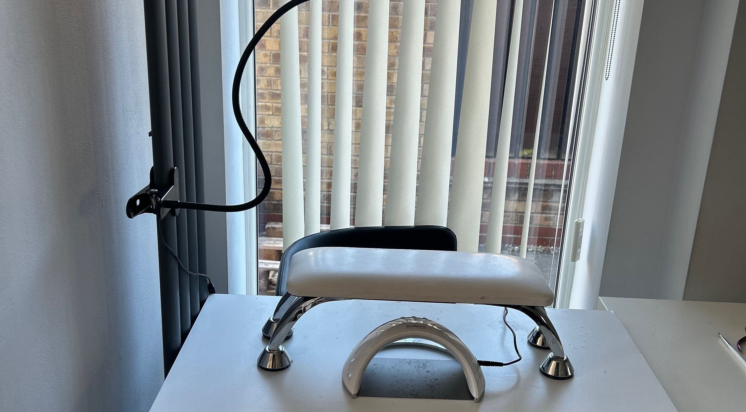 Modern nail station at ghnailsx in Huntington, England, GB with elegant lighting and sleek design.