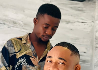 Expert barber styling at History Hair Studio, Accra, Greater Accra Region, GH. Perfect haircut experience.