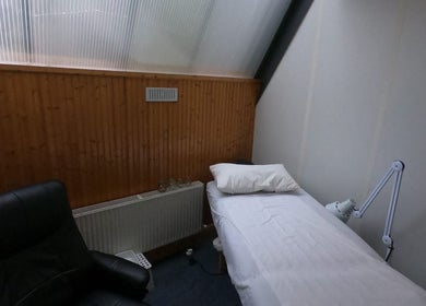 Tranquil Acupuncture room at Acupuncture by Mary, Dublin, County Dublin, IE, featuring a serene bed setup.