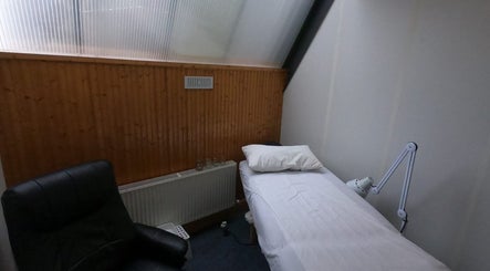 Tranquil Acupuncture room at Acupuncture by Mary, Dublin, County Dublin, IE, featuring a serene bed setup.