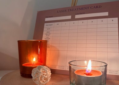 Cozy candles and a treatment card set the serene ambiance at Daisy’s Laser Hair Removal, Par, England, GB.