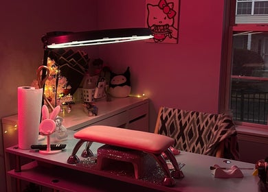 Warm interior of nailsxbrianni in Justice, Illinois, US, showcasing a stylish nail station with unique decor.
