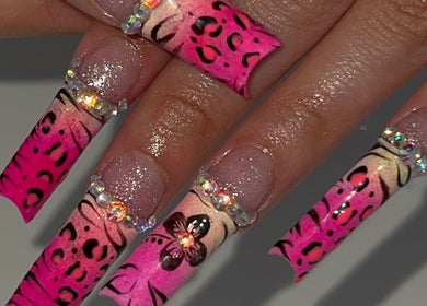 Stunning leopard print nails with rhinestones at nailsxbrianni, Justice, Illinois, US.