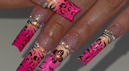 Stunning leopard print nails with rhinestones at nailsxbrianni, Justice, Illinois, US.