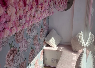 Cozy floral-painted nook with soft cushions at SkinbyTBI in Hornchurch, England, GB.