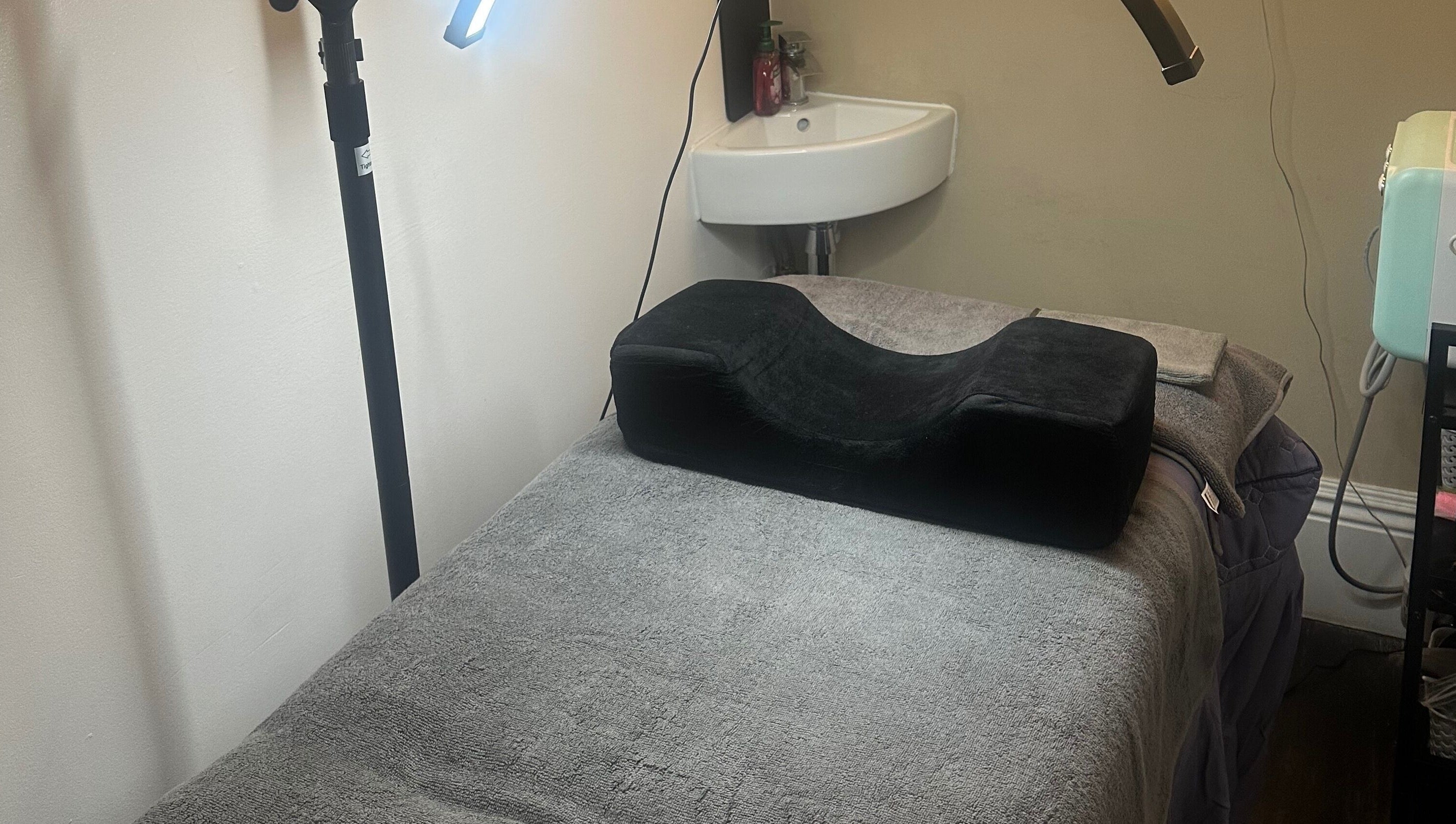 Spa treatment room with plush bed and lighting at My Way Beauty, London, England, GB.