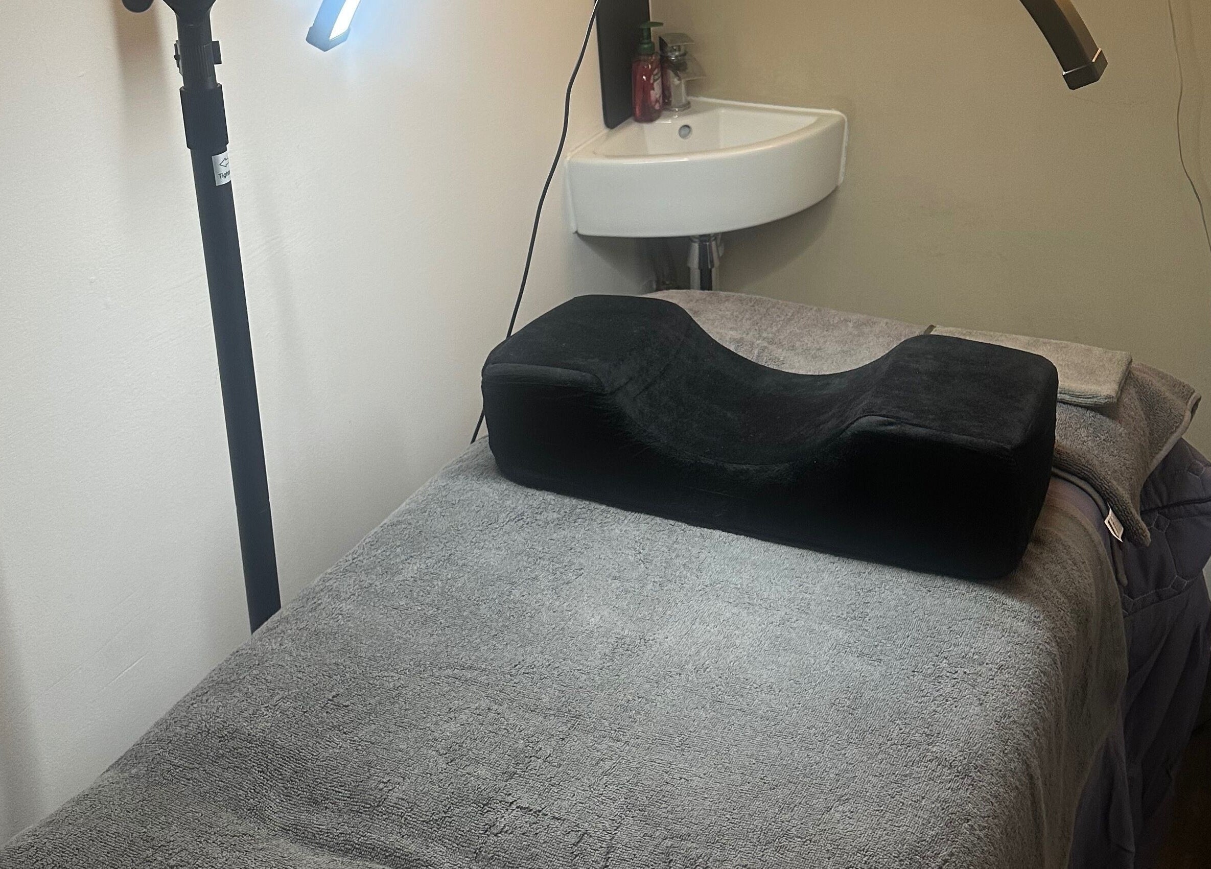 Spa treatment room with plush bed and lighting at My Way Beauty, London, England, GB.