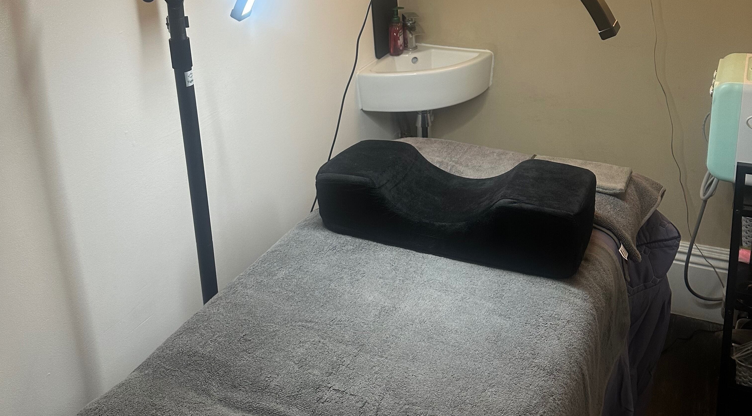 Spa treatment room with plush bed and lighting at My Way Beauty, London, England, GB.