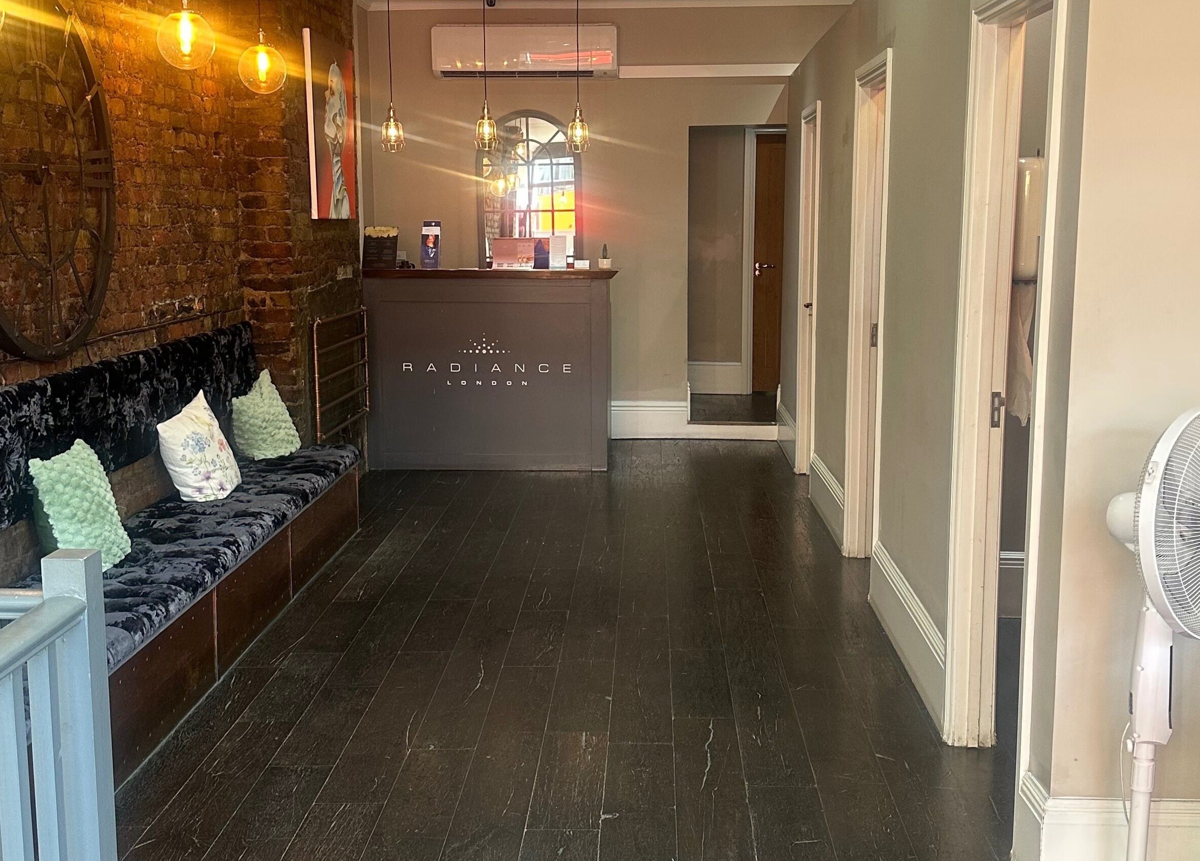 Cozy reception area at My Way Beauty, London, England, GB with plush seating and elegant decor.