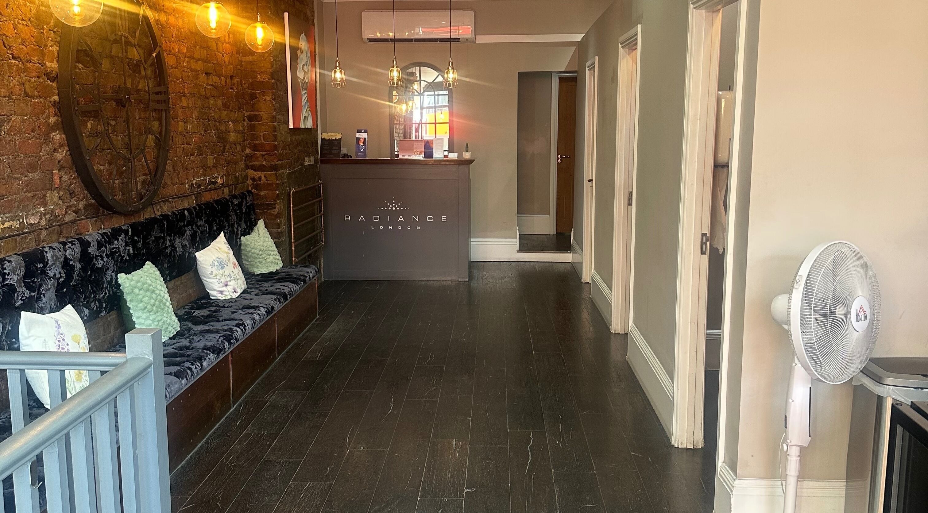 Cozy reception area at My Way Beauty, London, England, GB with plush seating and elegant decor.