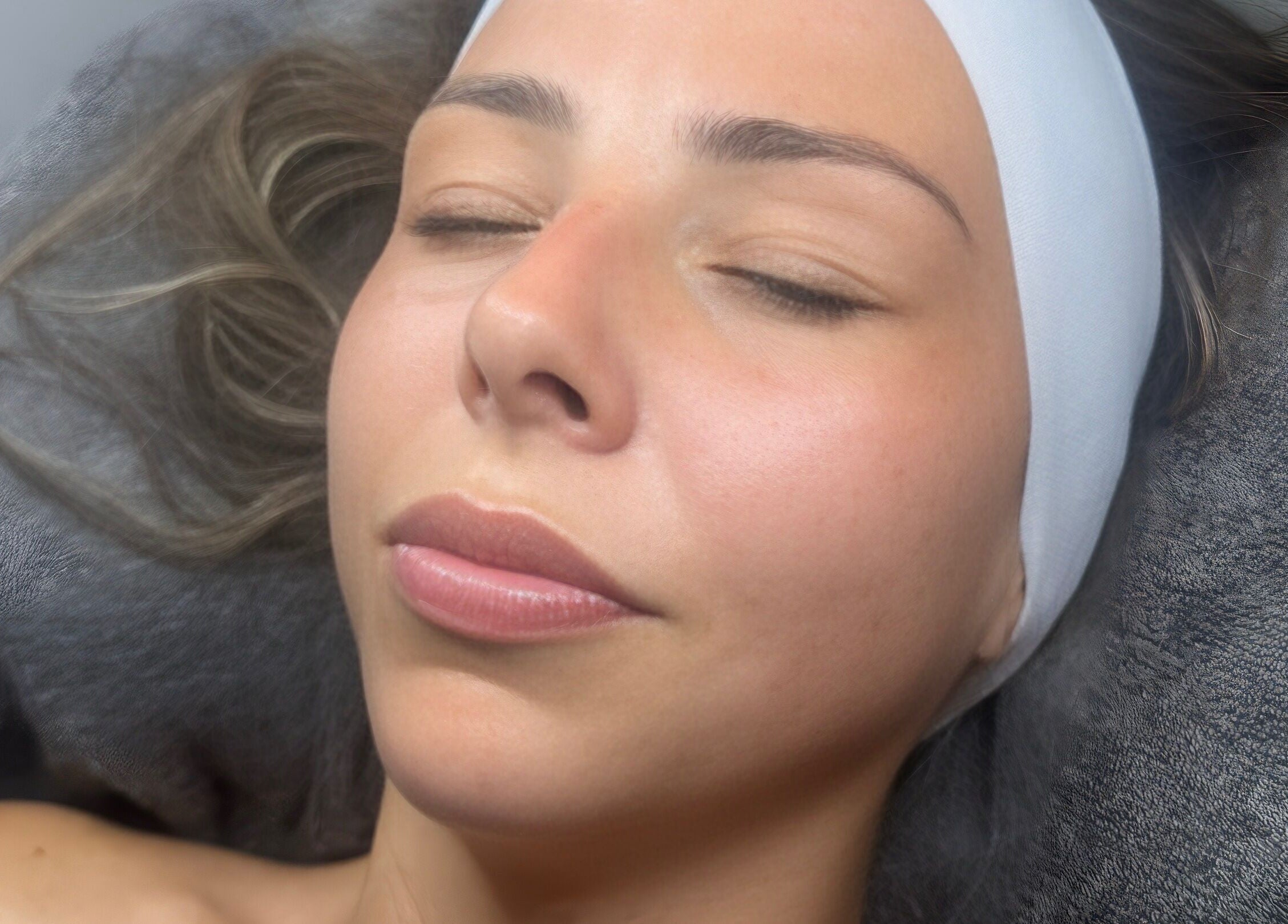 Relaxed client enjoying skincare treatment at My Way Beauty, London, England, GB.