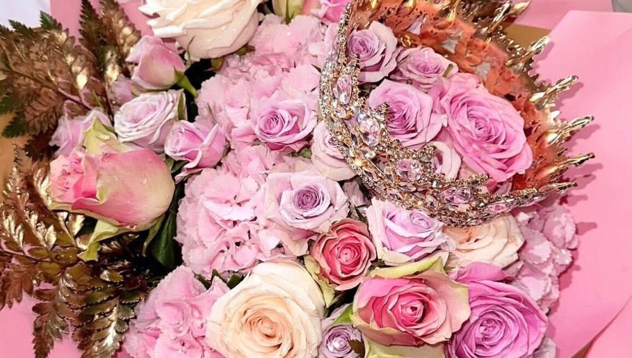Elegant bouquet with pink roses and crown at Skinfixuk, Manchester, England, GB.