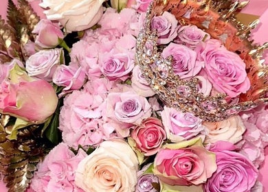 Elegant bouquet with pink roses and crown at Skinfixuk, Manchester, England, GB.