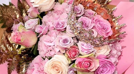 Elegant bouquet with pink roses and crown at Skinfixuk, Manchester, England, GB.