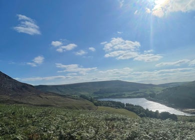 Peaceful hillside near Skinfixuk, Manchester, England, GB, with clear sky and scenic views.