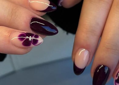 Elegant floral nail art in deep purple at Pink Muse, Aberdeen, Scotland, GB, showcasing intricate design details.