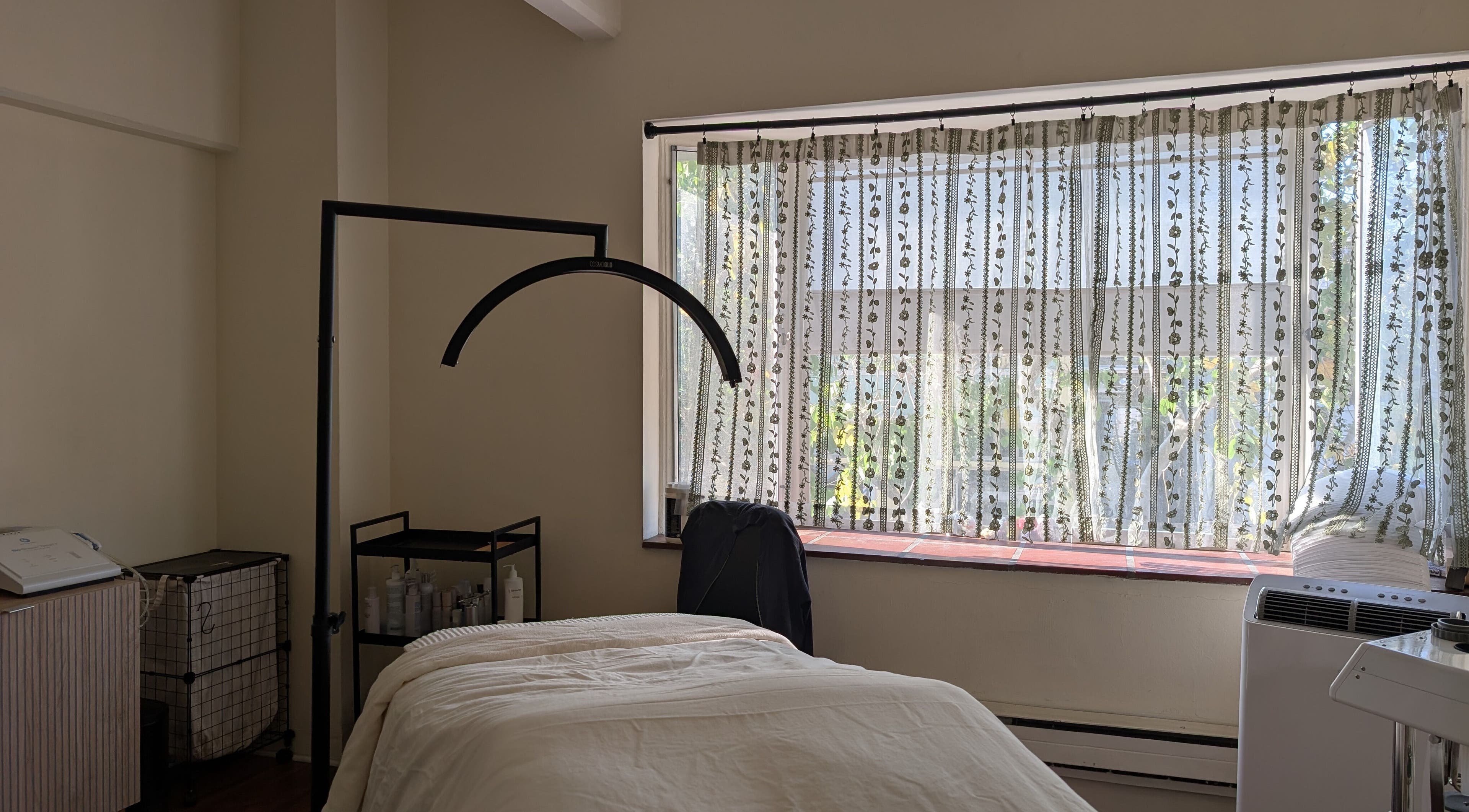 Theresa Irene Esthetics treatment room with soft lighting in Long Beach, California, US.