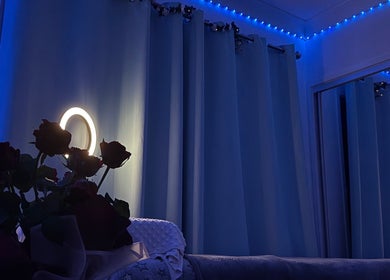 Cozy blue-lit room with flowers at Chic Beauty Studio, Landsborough, Queensland, AU.