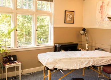 Tranquil therapy room at Taller De Lo Invisible (Atelier of the Invisible) in Portland, Oregon, US, with massage bed.