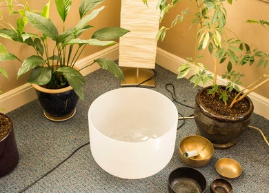 Peaceful meditation setup with plants and sound bowls at Taller De Lo Invisible, Portland, Oregon, US.