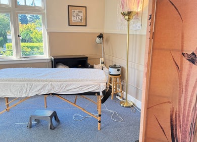 Peaceful massage room setup at Taller De Lo Invisible in Portland, Oregon, US, highlighting a relaxing ambiance.