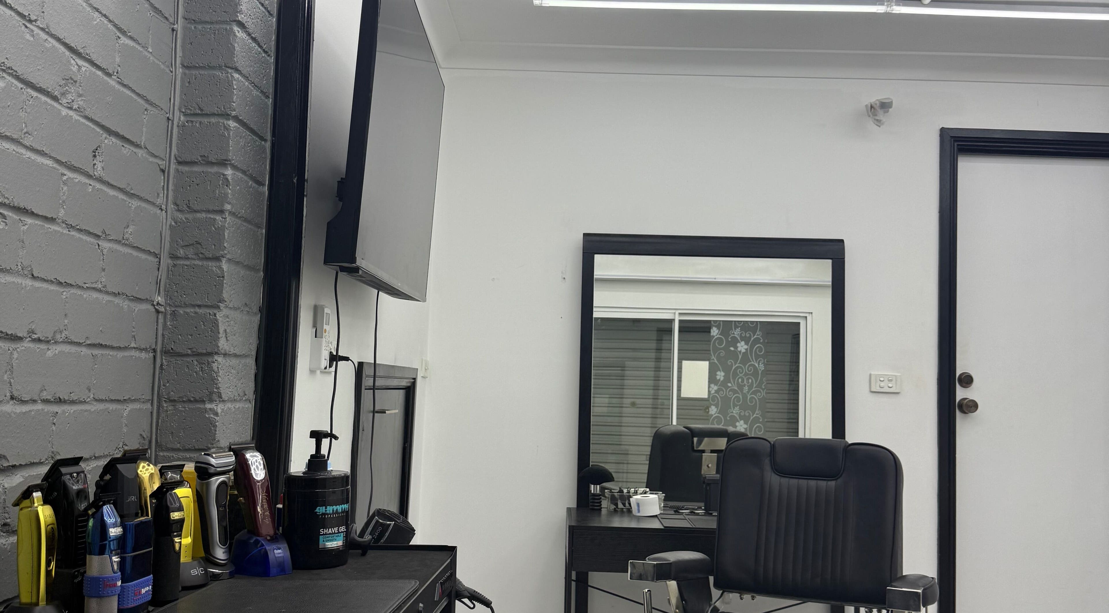 Modern salon setup at Novell Kuts, featuring styling tools and mirror, located in Edensor Park, New South Wales, AU.