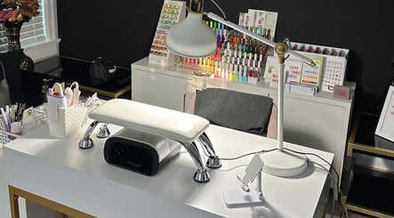 Nail care setup at Thumb Nail in Coquitlam, British Columbia, CA, showcasing organized polish displays.