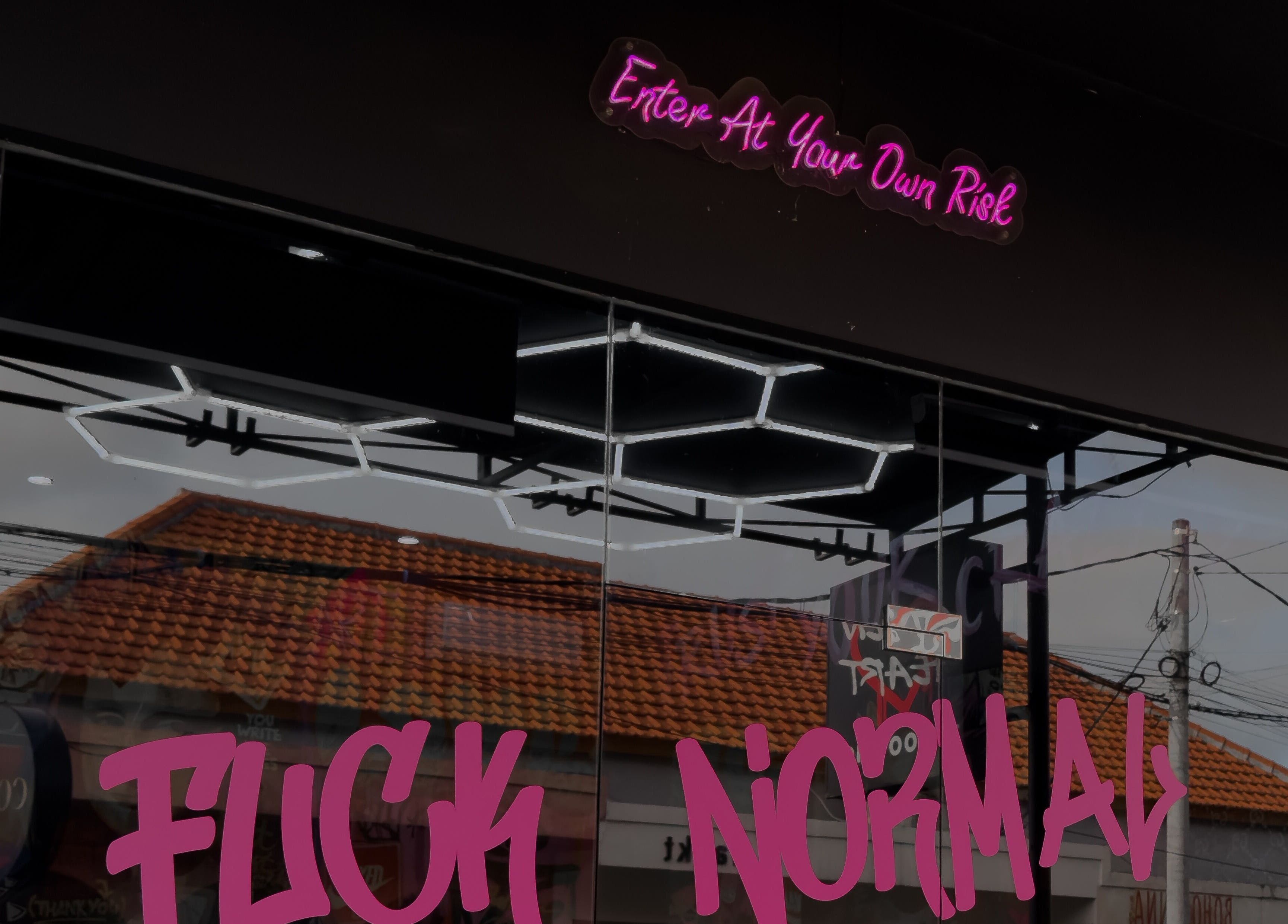 Entrance of Stolen Heart Tattoo Canggu with bold neon sign, Bali, Bali, ID.