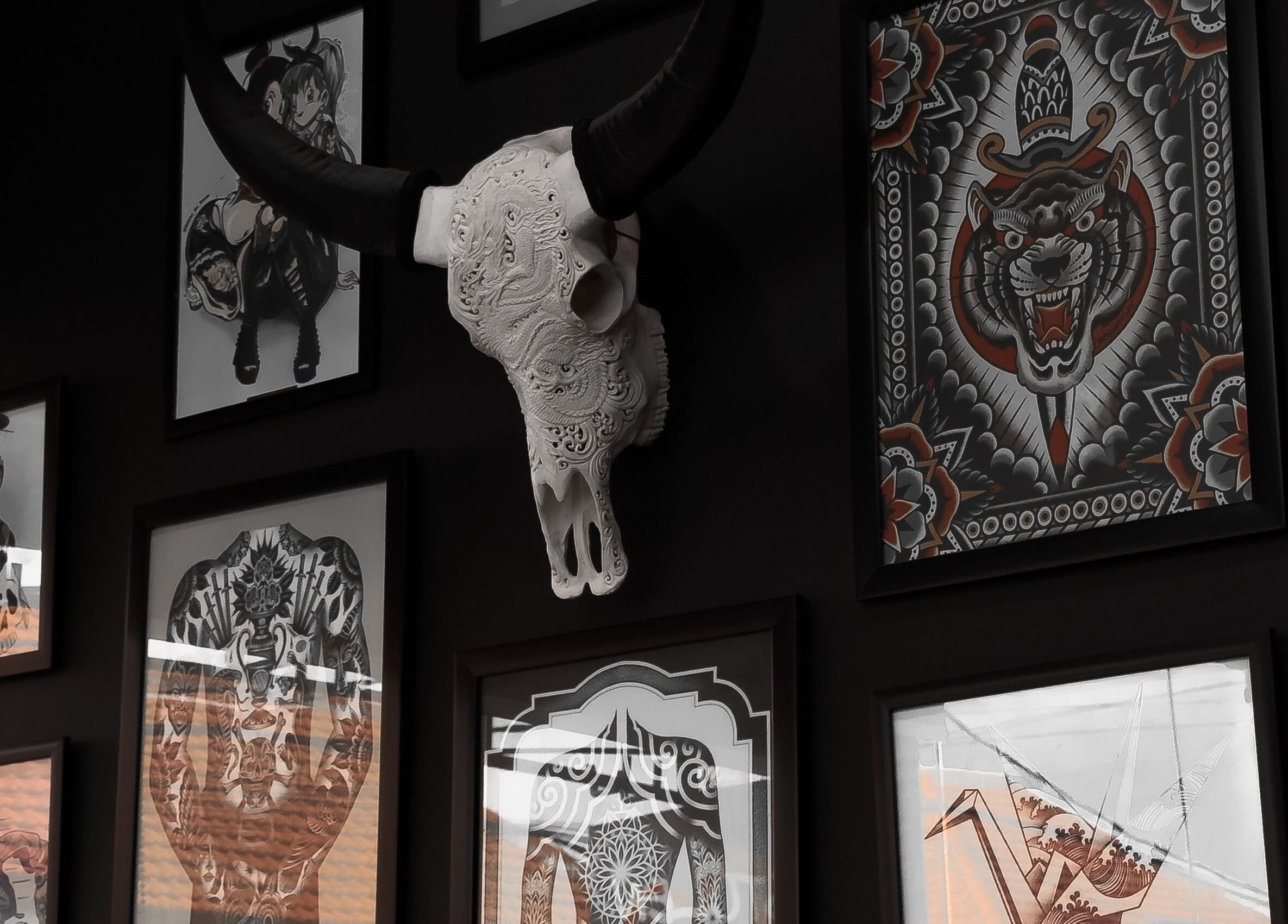 Vibrant art wall at Stolen Heart Tattoo Canggu showcasing intricate designs, Bali, Bali, ID.