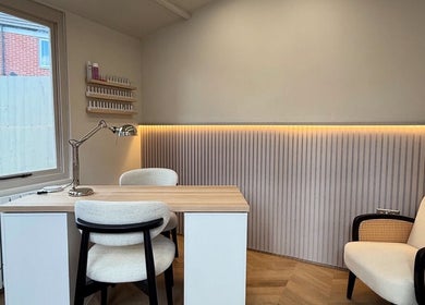 Sleek beauty workstation at Gloss Studio, Peterborough, England, GB with modern decor and ambient lighting.