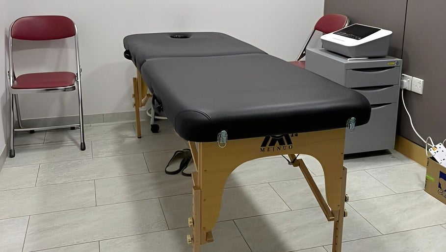 Treatment room with massage table at Totally Men Wellness, Singapore, Singapore, SG.