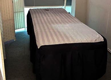 Cozy massage table at Totally Men Wellness, Singapore, SG. Perfect setting for ultimate relaxation.