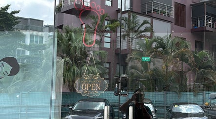Entrance with open sign at No 77 Jalan Malu Malu, Singapore, Singapore, SG. Inviting setting for beauty services.