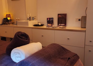 Serene massage room at LAVENDER Thai Therapy, Bundall, Queensland, AU with towels and calming ambiance.