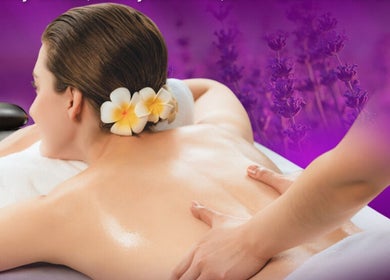 Relaxing massage at LAVENDER Thai Therapy, Bundall, Queensland, AU with flowers and lavender backdrop.