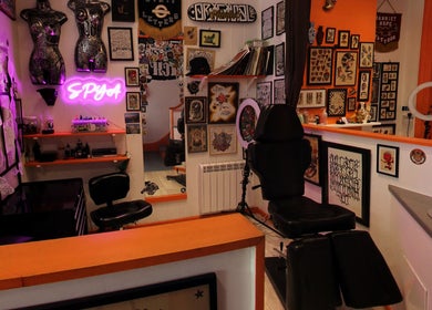 Tattoo studio at Lion Heart Aesthetics And Piercings, Brighton And Hove, England, GB, showcasing vibrant art and designs.