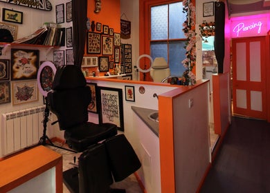 Lion Heart Aesthetics And Piercings in Brighton And Hove, England, showcases vibrant, art-filled interior decor.