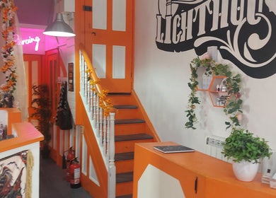 Colorful interior of Lion Heart Aesthetics And Piercings, Brighton And Hove, England, GB, decorated with plants.