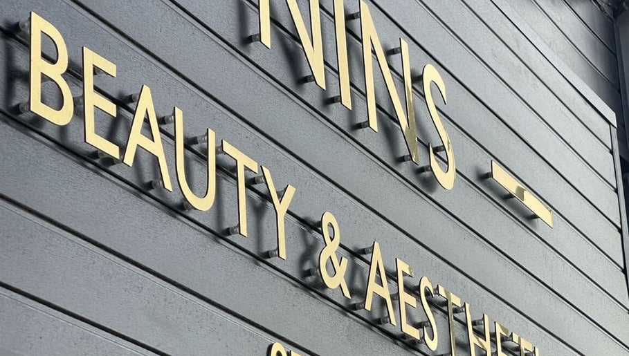 Nins Beauty & Aesthetics signage with gold letters in Shipley, England, GB.