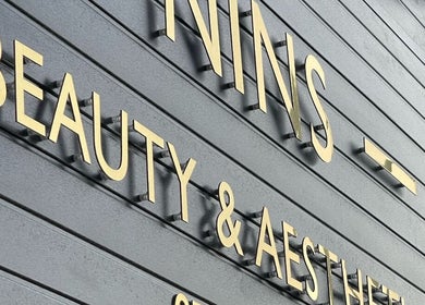 Nins Beauty & Aesthetics signage with gold letters in Shipley, England, GB.
