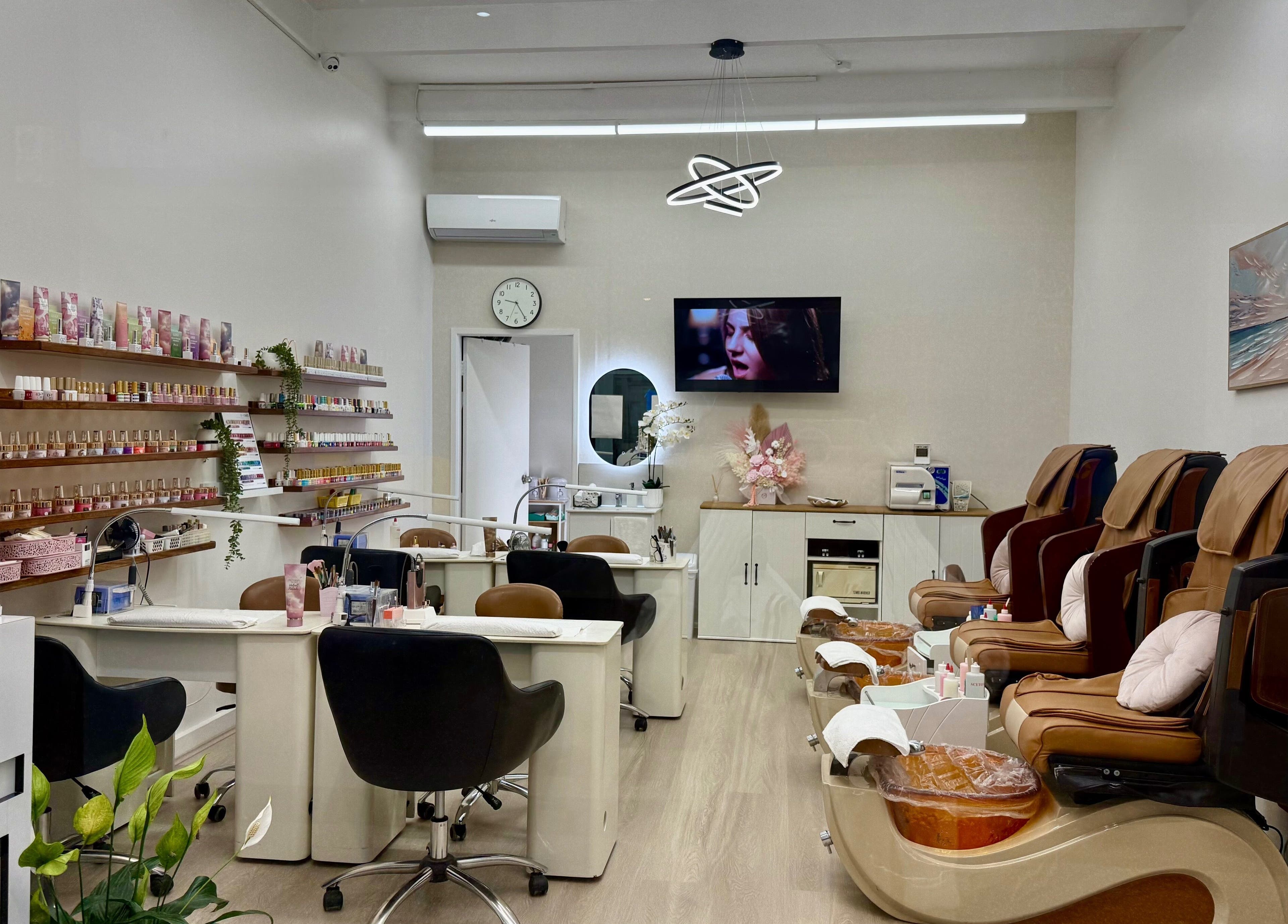 Interior of Engadine Beauty and Nails in Engadine, New South Wales, AU with manicure stations and pedicure chairs.