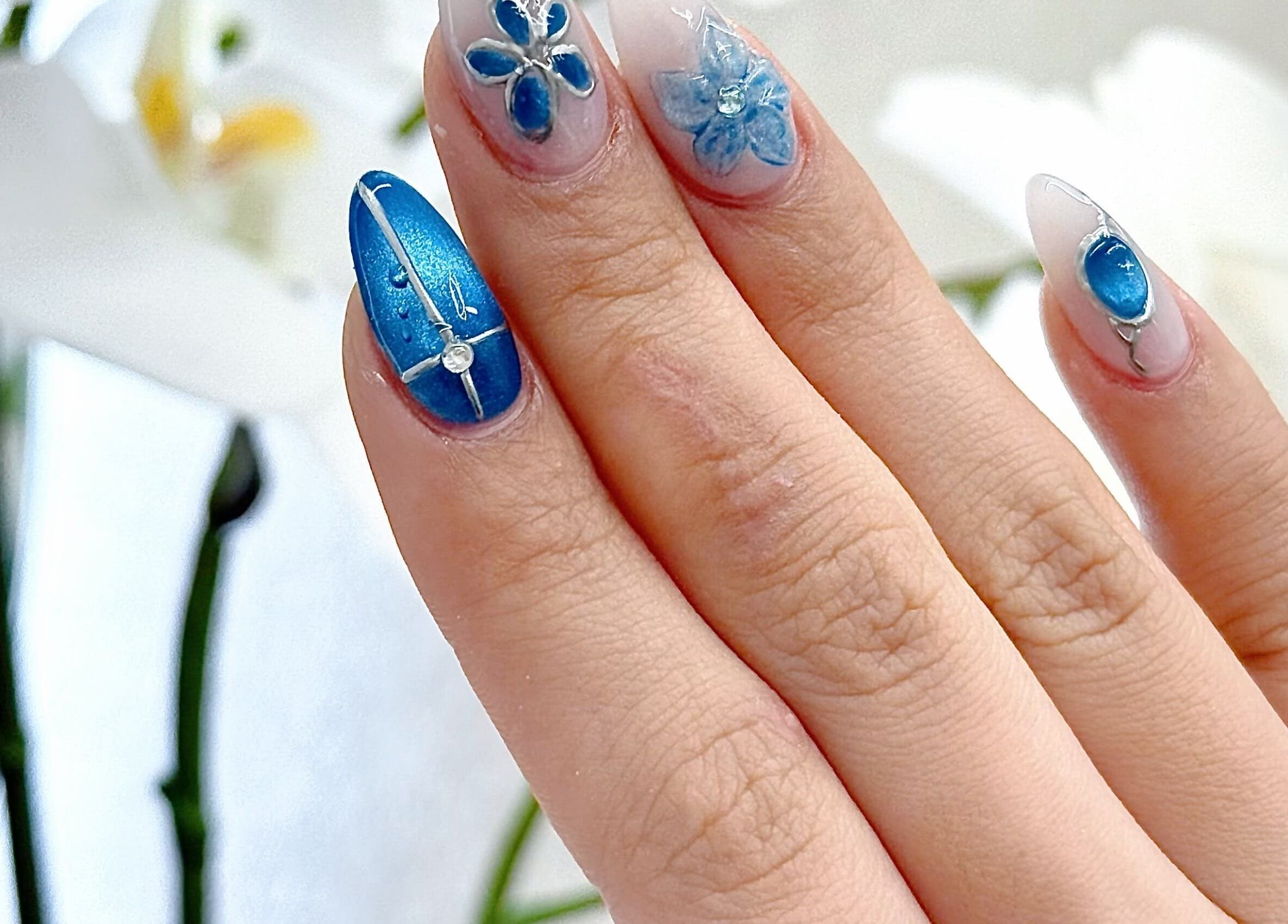 Intricate blue floral nail art at Engadine Beauty and Nails, Engadine, New South Wales, AU.